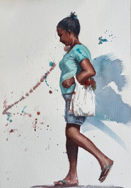 Brazilian woman walking down a street in hot sun