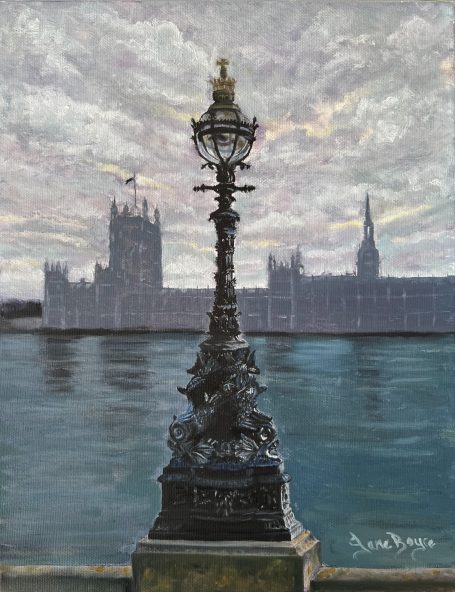 Lamppost in London overlooking the Thames river and Houses of Parliament