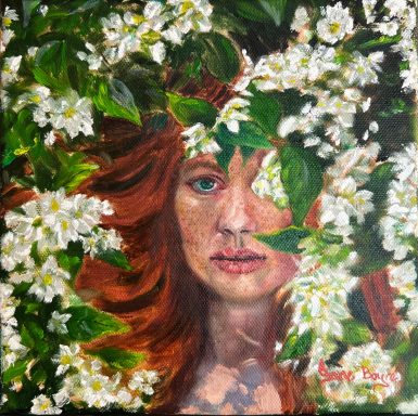 auburn haired woman's face partially covered by white flowers and leaves